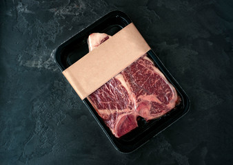 Raw beef steak t-bone in vacuum Packed, mockup for design idea