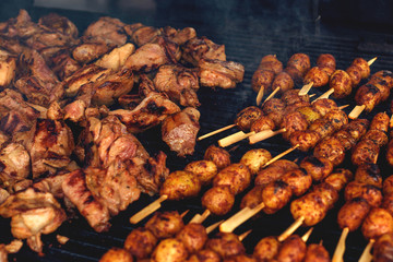 cooking meat and young potatoes on the grill