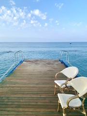 Two chairs near to beach in summer