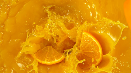 Poster - Freeze motion of pouring orange juice. Top view, close-up.