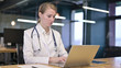 © stockbakers - Young Female Doctor Working on Laptop in Office
