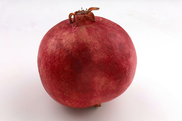 Wall Mural - Pomegranate fruit on a white background