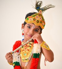 Portrait Of Boy Wearing Costume Against White Background