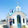 Man Standing Outside Church Against Clear Blue Sky