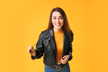 Poster - Stylish young woman on color background