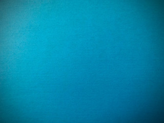 Blue paper texture. Beautiful blue background with darkened edges