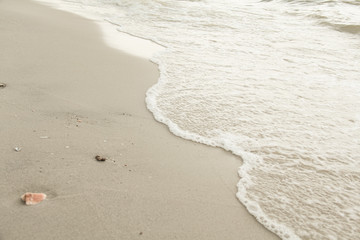 Sand with small wave at sea. Beach and sea