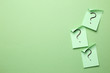 © Sanga - Question mark on memo paper on green background. Solution concept