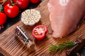 Fresh raw chicken fillet and vegetables prepared for cooking