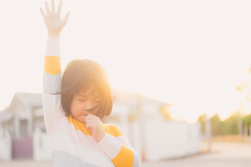 Wall Mural - Kid girl praying and worship to GOD.Little girl praying to The LORD in the morning.Hand praying,Raised Hands in prayer on the sky in the morning concept for faith, spirituality,Freedom and religion.