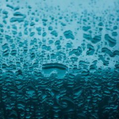 Water drops on glass surface as abstract background