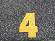 © Phaprae - number 4 on parking lot.paint on the road.