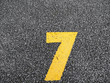 © Phaprae - number 7 on parking lot.paint on the road.
