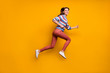 © deagreez - Full length profile side photo of cheerful girl jump run fast after spring discounts wear sweater sneakers isolated over shine color background