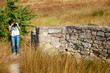 © Arsentyev Vladimir - Thin girl photographs ancient stone wall