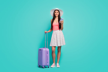 Canvas Print - Full size photo positive girl tourist use cellphone book taxi service hold purple suitcase enjoy travel weekend wear white plaid checkered skirt pink singlet isolated pastel teal color background