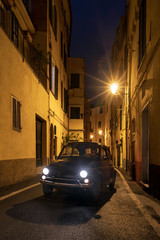 Canvas Print - Classic car cruising on the road