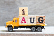 © bankrx - Truck hold letter block in word 1aug on wood background (Concept for date 1 month August)