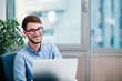 © Suteren Studio - Young businessman in office working on laptop