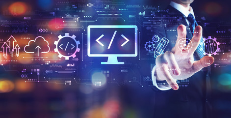 Web development concept with businessman on night city background