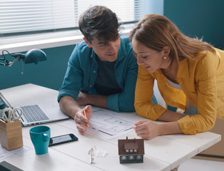 Young couple working on their house project together