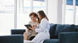 © Near - Young doctor consulting senior patient at health care clinic