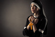 beautiful young  nun prays to god