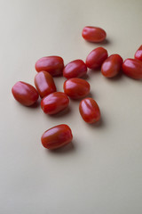 red bright tomatoes on a monotone background