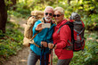 © ivanko80 - Happy senior couple of hikers in the forest.