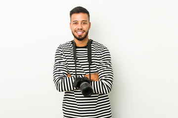 Young south-asian photographer laughing and having fun.