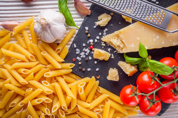 concept of traditional italian pasta with tomatoes and basil