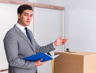 Man signing for the delivery of boxes