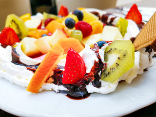 Wall Mural - Fresh fruits mix with vanilla ice cream and crepe.