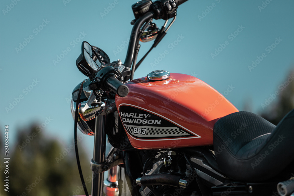Russia-July 7, 2018: Orange Harley-Davidson Sportster 883 Russia-July 7, 2018: Orange Harley-Davidson Sportster 883