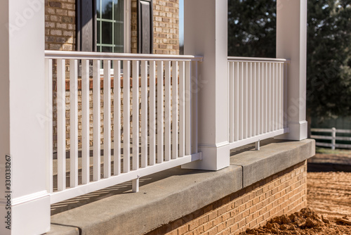 Cuadros en Lienzo Covered porch with brick siding, pre cut and pre mitered white columns, column w