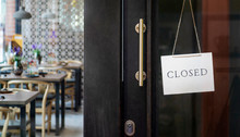  Closed Sign Hanging Outside A Restaurant, Store, Office Or Other