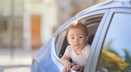 One baby girl travel on car