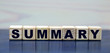 © Zhanna - concept word summary on wooden cubes on a beautiful background