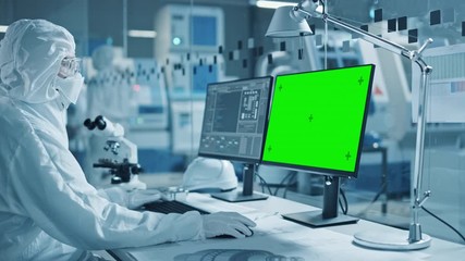Aufkleber - Research Factory Cleanroom: Close-up of Engineer / Scientist wearing Coverall and Gloves Uses Microscope, Computer Shows Chroma Key / Green Screen Display. Scientific and Electronics Research Facility