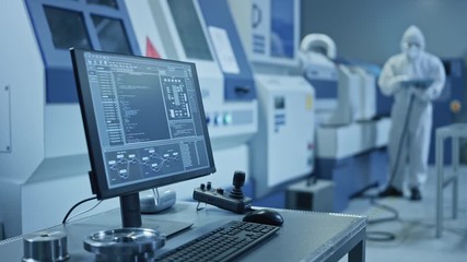 Leinwandbilder - Factory Cleanroom: On the Desk Personal Computer Showing Infrastructure System Control on its Display. In Background CNC Machinery Professionals Use Robot Arm on Production Line, Electronics Equipment