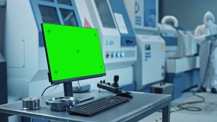 Leinwandbilder - Factory Cleanroom: On the Desk Personal Computer Showing Green Screen Chroma Key Display. In Background CNC Machinery, Professionals Use Robot Arm on Production Line. Arc Shot