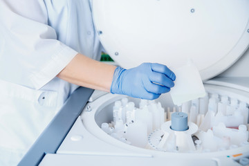 Wall Mural - scientist downloads blood samples to test dna, hiv, aids, virus on laboratory