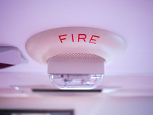 Smoke Detector And Fire Alarm Mounted On Roof In Apartment