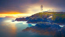 Twilight Yields To Dawn, Sunrise At Fanad Head Lighthouse With Blurred Water Of Atlantic Ocean