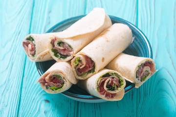 Wall Mural - Sliced sandwich tortilla with vegetables and ham