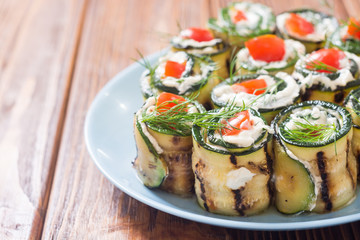 Wall Mural - Zucchini rolls with cream cheese , tomatoes and dill