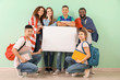 © Pixel-Shot - Young students of language school with blank poster near color wall