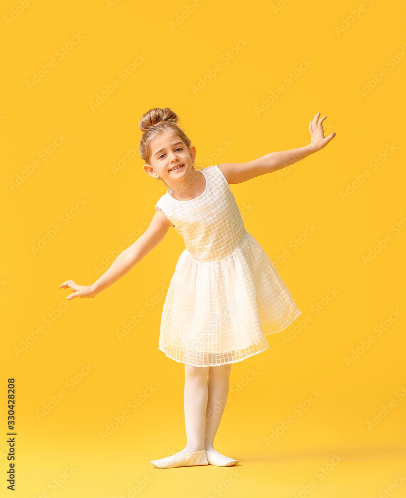 Cute little ballerina on color background