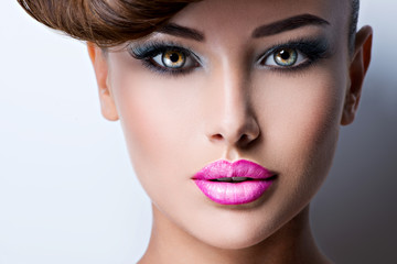 face of beautiful woman with fashion vivid color makeup