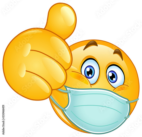 Fotografía Emoji emoticon with medical mask over mouth showing thumb up